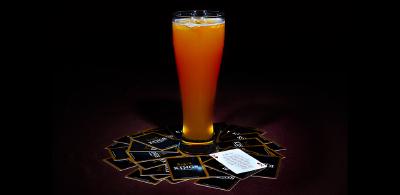 Beer with playing cards on table