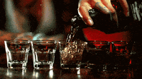 Alcohol Shots Bartender filling up shots