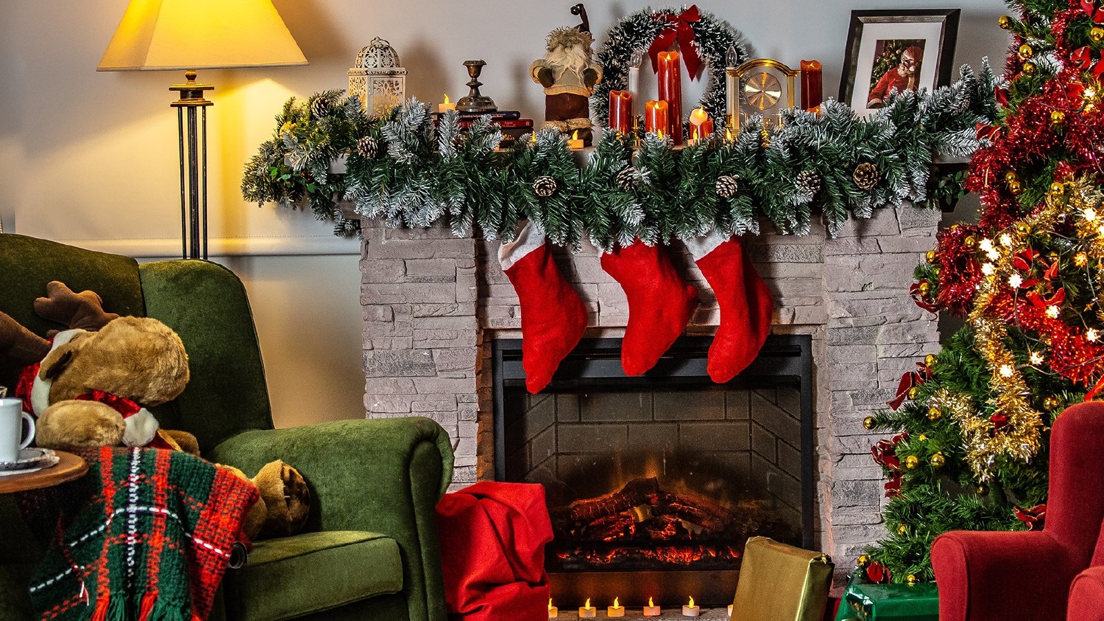 A room with christmas decorations like stockings, garlands, and christmas rugs